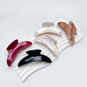 Five-piece crescent acrylic claw clip set in assorted marble finishes and solid black color