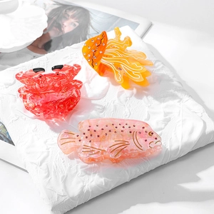 Three creative ocean-themed hair claws with crab and jellyfish shapes in high-quality acetate