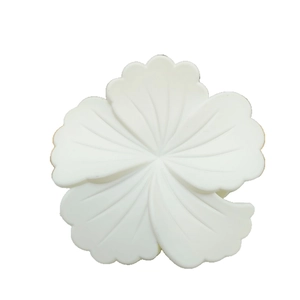 Elegant white floral claw clip with matte finish and five-petal design for hair styling
