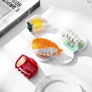Creative food-shaped hair claw clips set including milk carton, sushi, and fried egg styles