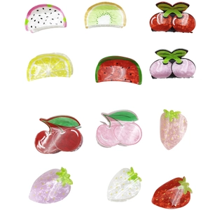 Variety of cute fruit-shaped hair claws including cherry, watermelon, and strawberry