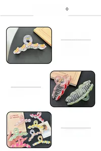 Close-up of colorful acrylic fruit claw clips with spring bite and transparent patterns