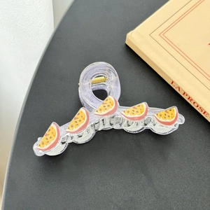 Sparkly purple acrylic shark hair claw clip with realistic passion fruit pattern