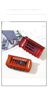 Detail of red vintage telephone booth hair claw clips with printed lettering