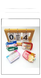 Detail view of colorful school-themed resin hair claws including pencil and book designs
