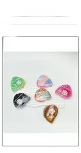 Detailed view of six colorful acrylic hair claws featuring baseball glove design and stitching