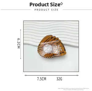 Detail view of baseball glove claw clip with dimensions 7.5cm by 6.2cm and turtle shell texture