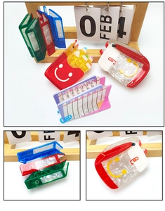 Detailed view of colorful stationery shaped hair claws made of premium marble acetate