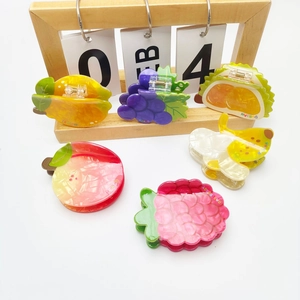 Colorful acetate fruit hair claws featuring lemon, grape, and banana shapes for girls
