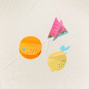 Three-piece fruit themed acetate hair claws featuring watermelon, orange, and lemon designs