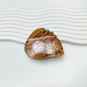 Acrylic hair claw clip with baseball glove design and checkered pattern on white background