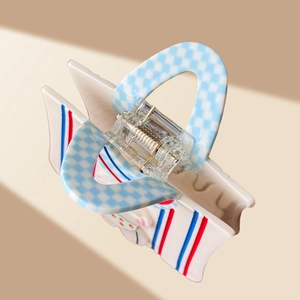 Cartoon acetate hair claw clip with blue plaid pattern and cute rabbit embellishment