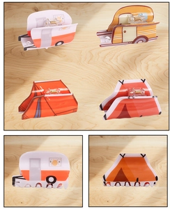 Close-up detail of acrylic camping hair claws featuring caravan and tent designs