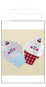 Detail of ice cream hair clips with cherry pattern and checkered base in blue and red
