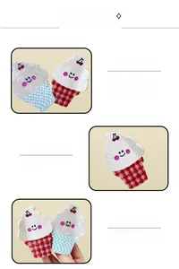 Close-up of ice cream hair claw clip with cherry decor and checkered pattern details