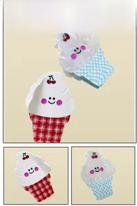 Detail view of ice cream hair claws with cherry and checkerboard patterns