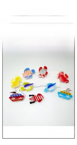 Detail showing colorful acrylic claw clips with ocean theme fish and seahorse designs