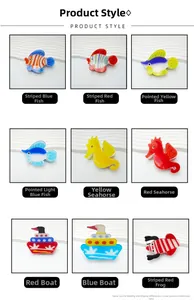Detailed grid view of cute acrylic hair claws in colorful fish, seahorse and boat shapes