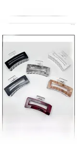 Detailed set of six colorful rectangular hair claw clips in various marble patterns