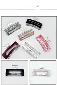 Detailed close-up showing durable metal spring and marble texture of large hair claw clips