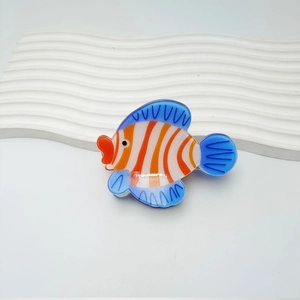 Sparkly clownfish acrylic hair claw clip with vibrant orange and white stripes and blue fins