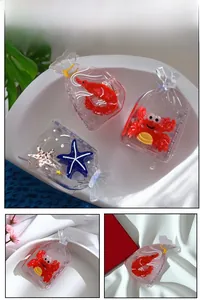 Detail showing creative transparent acetate hair claws in lobster, crab, and starfish shapes