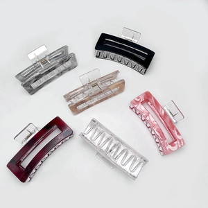 Set of six large acrylic hair claw clips in various marble and solid patterns