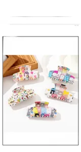 Detailed view of large hair clips featuring cute cartoon animal prints and big clip design