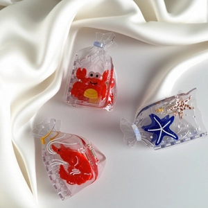 Creative ocean creature hair claws in transparent acetic acid with crab and starfish shapes
