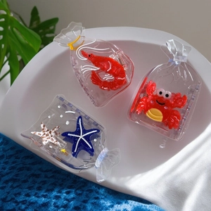 Creative ocean theme acetate hair claws featuring shrimp, crab and starfish in clear design