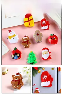 Detailed view of nine acrylic Christmas themed hair claws including Santa and snowmen