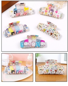 Detail view of five assorted cartoon animal hair claws with cute bear and rabbit prints