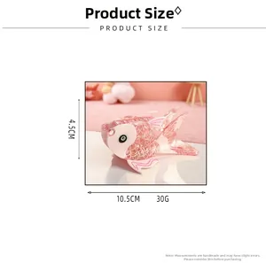 Pink goldfish hair claw clip made of acetate with dimensions 10.5cm by 4.5cm detailed view
