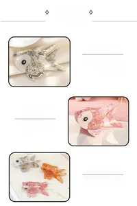 Detailed close-up of handmade koi fish acetate hair claws in grey, orange, and pink colors