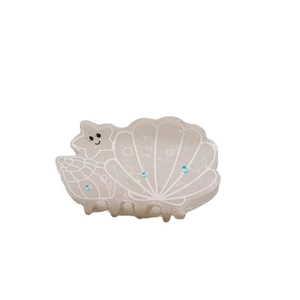 Iridescent seashell hair claw clip with star and conch design in pearlescent finish