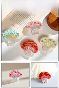 Macro detail of cute mushroom hair clips in pink and blue colors with spot texture
