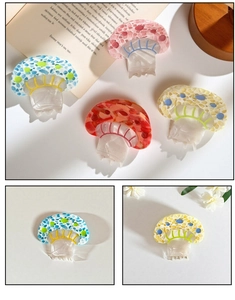 Macro detail of mushroom shaped hair claw clips in colorful acetic acid textures