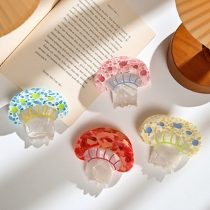 Cute mushroom hair claws in colorful acetate with marble patterns for a trendy look