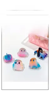 Detail view of 5-piece gradient resin Halloween ghost and pumpkin hair claw clips
