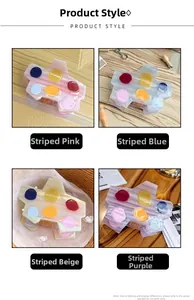 Détails rapprochés de pinces à cheveux en acétate coloré au design palette d'artiste