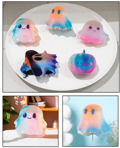 Macro view of gradient Halloween hair claw clips with glitter finish and cute ghost shapes