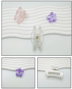 Detail shot of purple floral and pearlescent resin hair claws with durable metal springs