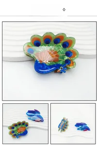 Detailed views of peacock and tropical fish hair claws in colorful acetate resin finish