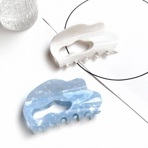 Elegant cloud-shaped hair claw clips with mother of pearl texture in white and light blue