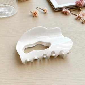 Elegant white mother-of-pearl cloud hair claw clip with glossy wave design for women