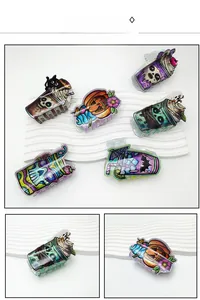 Detail of Halloween acrylic hair claws with colorful pumpkin and ghost drink designs