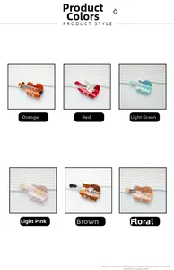 Detail view of colorful acrylic violin and guitar hair claws in a variety of stylish patterns
