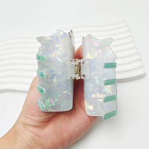 Iridescent white pumpkin drink cup hair claw clip for Halloween festive styling