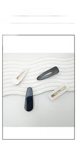 Detail of four-piece Korean hairpin set with acrylic black and white minimalist clips