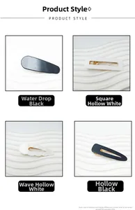 Detail view of four minimalist acrylic hair clips in black and white geometric styles